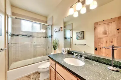a bathroom with a sink and a shower and a toilet at 1376MD Angora View in South Lake Tahoe