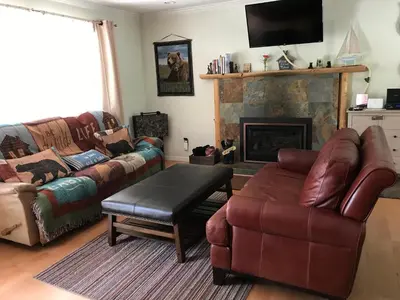 a living room with a couch and a fireplace at Peace of Heaven 2566C in South Lake Tahoe