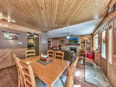 a kitchen and dining room with a wooden ceiling at 2556H Lazy Bear's Den in South Lake Tahoe