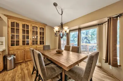 a dining room with a wooden table and chairs at 1213GB Golden Bear Tahoe Home in South Lake Tahoe