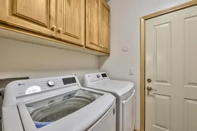 a washer and dryer in a small room at 1213GB Golden Bear Tahoe Home in South Lake Tahoe