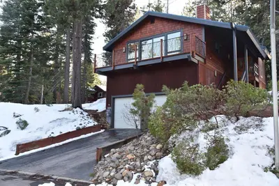 a house with a garage in the snow at 2375S Sierra house Retreat in South Lake Tahoe