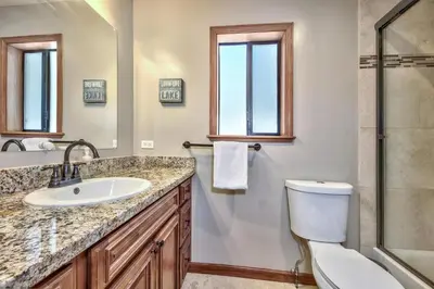 a bathroom with a sink and a toilet and a shower at 1760T Thunderbird Cabin in South Lake Tahoe