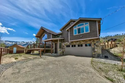 a custom built home with a driveway at Mountain View Retreat 1008C in South Lake Tahoe
