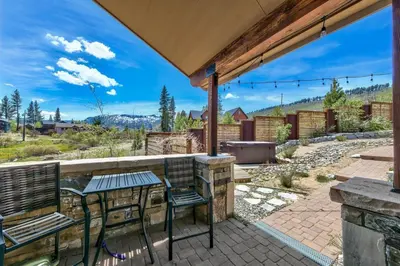 a patio with a table and chairs and a grill at Mountain View Retreat 1008C in South Lake Tahoe