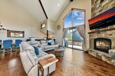 a living room with a couch and a fireplace at Mountain View Retreat 1008C in South Lake Tahoe
