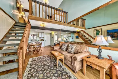 a living room with a couch and a staircase at 920 Bal Bijou in South Lake Tahoe