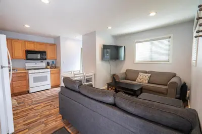a living room with a couch and a kitchen at RR-Birch_Creek 2 in June Lake