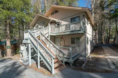 a house with a staircase leading up to a house at RR-Birch_Creek 2 in June Lake