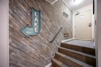 a brick wall with a sign that reads ask this this way at Stunning Deluxe King Studio #124 at Donner Lake Village in Truckee