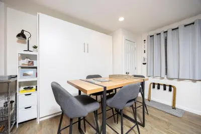 a dining room with a wooden table and chairs at Stunning Deluxe King Studio #124 at Donner Lake Village in Truckee