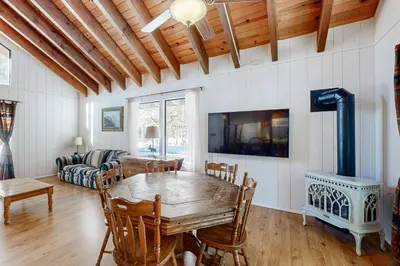 a dining room with a table and a couch at Less Than 2 Mi to Tahoe Donner Ski Resort Serene Retreat in Armstrong