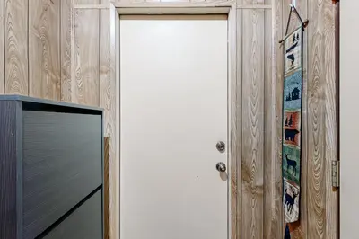 a door in a room with a television at Less Than 2 Mi to Tahoe Donner Ski Resort Serene Retreat in Armstrong