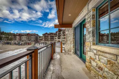 a balcony of a apartment building with a window at Big Horn Lodge 202 by East West Hospitality in Truckee