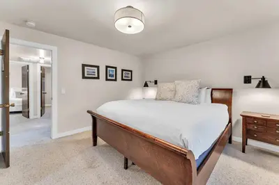 a bedroom with a large bed and a dresser at Lake Tahoe Getaway Close to Beach & Ski Slopes in Tahoe City