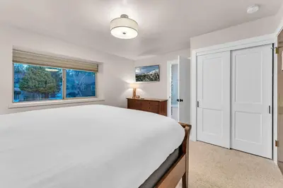 a bedroom with a large white bed and a window at Lake Tahoe Getaway Close to Beach & Ski Slopes in Tahoe City