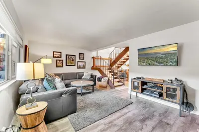 a living room with a couch and a table at Lake Tahoe Getaway Close to Beach & Ski Slopes in Tahoe City