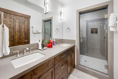 a bathroom with two sinks and a shower at Luxurious Truckee Rental Hot Tub and Valley Views in Truckee