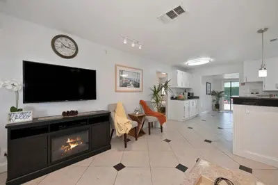 a living room with a tv and a fireplace at Arden Calexpo HotTub Pool Firepit BBQ NoPetFee in Sacramento