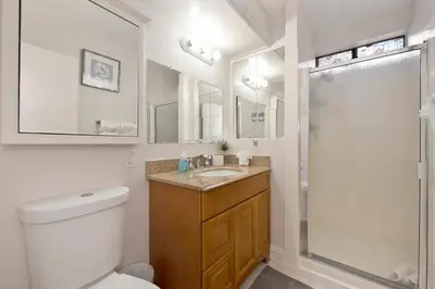 a bathroom with a toilet and a sink and a shower at Arden Calexpo HotTub Pool Firepit BBQ NoPetFee in Sacramento