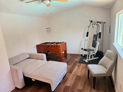 a living room with a couch and a table at Arden Calexpo HotTub Pool Firepit BBQ NoPetFee in Sacramento