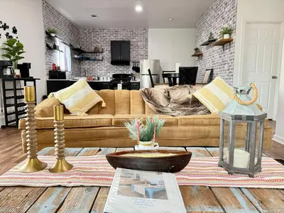 a living room with a couch and a table at GUEST RANCH HOUSE w POOL access near NATL PARKS in Dinuba