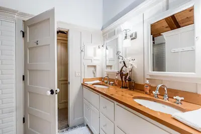 a bathroom with two sinks and a large mirror at Lakefront Luxury in Tahoe City