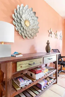 a room with a table with a flower on the wall at Happy Hours - Beautiful Quiet Comfortable Suite #3 in Visalia