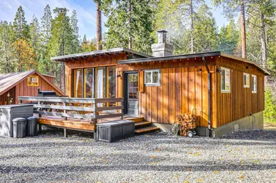 a wooden cabin with a staircase and a porch at Walk to Golf, Lake Twain Harte Cabin with Fireplace in Twain Harte