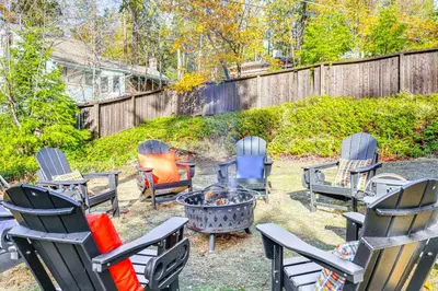 a group of chairs sitting around a fire pit at Walk to Golf, Lake Twain Harte Cabin with Fireplace in Twain Harte