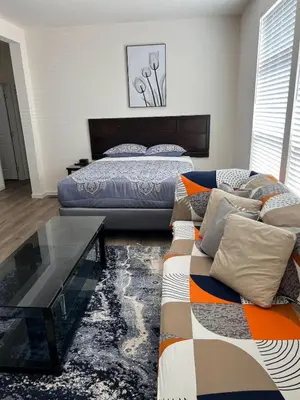 a bedroom with a bed and a coffee table at Brand New Scenic Sequoia House in Three Rivers