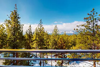 a view from the balcony of a house with trees at Cliffside Retreat in Zephyr Cove