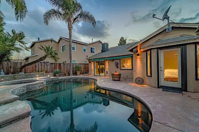 a swimming pool in the backyard of a house at Casita Andrade in Turlock