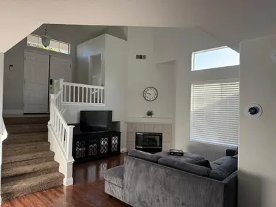 a living room with a couch and a fireplace at Luxury Escape in Stockton