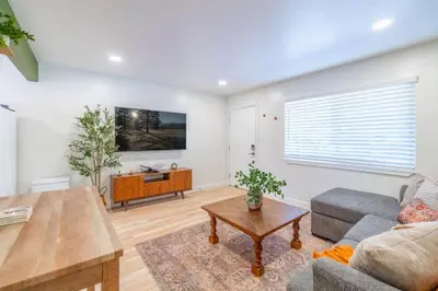 a living room with a couch and a table at Emerald Escape - UNR & Pet Friendly in Reno