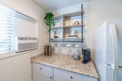 a kitchen with a counter and a refrigerator at Emerald Escape - UNR & Pet Friendly in Reno