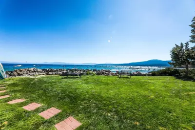 a park with benches and a view of the ocean at Lakeside Life in Tahoe Vista