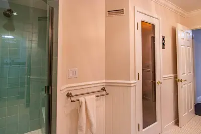 a bathroom with a shower and a towel rack at Falls Lake View Winter Special Ends512 in Bass Lake