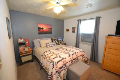 a bedroom with a bed and a ceiling fan at Ledge House-Lake Area Free Night Special in Bass Lake