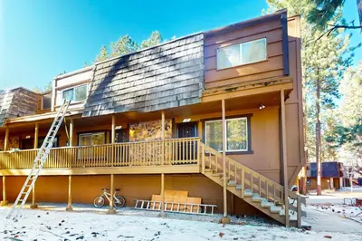 a house with a ladder in front of it at Wildwood Wonder in South Lake Tahoe