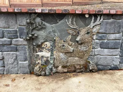 a mural of two deer on a brick wall at Greystone Manor- HUGE home with sleeping for 21 in Oakhurst