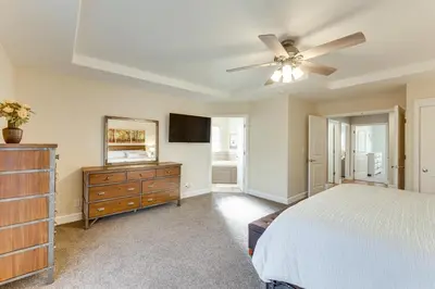 a bedroom with a bed and a ceiling fan at Walk Downtown Remodeled Home in Murphys with Yard! in Murphys