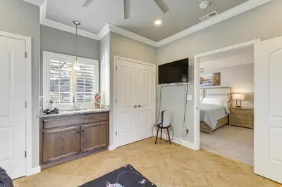 a bedroom with a bed and a sink and a refrigerator at Walk Downtown Remodeled Home in Murphys with Yard! in Murphys