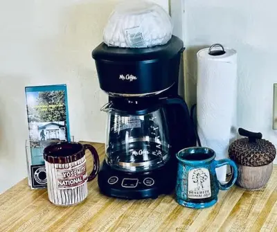 a coffee maker sitting on a counter with two cups at Inside Yosemite Park-Cozy Corner Unit-Sleeps 2 in Yosemite West