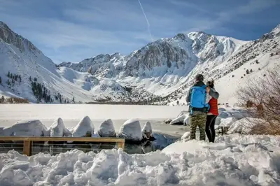 a group of people standing in the snow at Meadow Ridge 44 in Mammoth Lakes