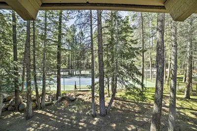 a view of a lake through the trees at Sunshine Village #108- 1 +Loft , Sleeps 6. Steps from Free Town Shuttle ,Dog Friendly in Mammoth Lakes