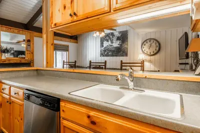 a kitchen with a sink and a counter top at Sunshine Village #108- 1 +Loft , Sleeps 6. Steps from Free Town Shuttle ,Dog Friendly in Mammoth Lakes