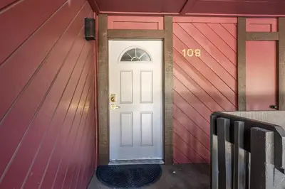 a white door in a house with red panels at Sunshine Village #108- 1 +Loft , Sleeps 6. Steps from Free Town Shuttle ,Dog Friendly in Mammoth Lakes