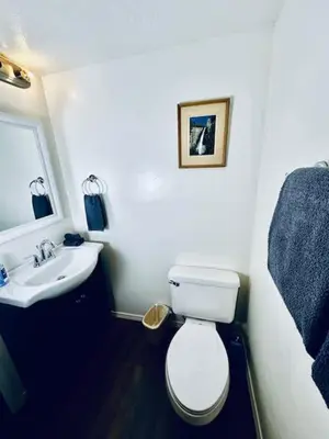 a bathroom with a white toilet and a sink at Treetop Condo in Yosemite-Sleeps 6-Balcony in Yosemite West