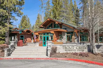 a building with a sign in front of it at Donner Gem by Tahoe Getaways - Beautifully Updated, Hot Tub, Pet Friendly in Truckee